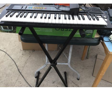 A CASIO CTK-50 KEYBOARD ON A STAND IN WORKING ORDER 