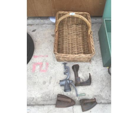 A VINTAGE WICKER PICNIC BASKET,TWO IRONS,A SHOE LAST AND A MINCER 