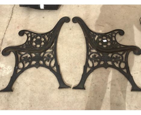 A PAIR OF ORNATE CAST IRON BENCH ENDS 