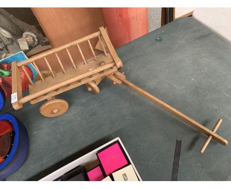 A SMALL VINTAGE WOODEN TOY CART 