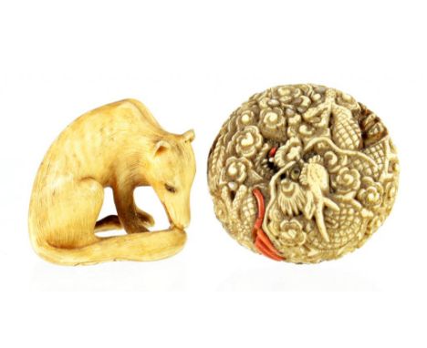TWO JAPANESE IVORY NETSUKE, ONE IN THE FORM OF A SEATED DOG, 2.5CM H, SIGNED, THE OTHER ONE ROUND AND CARVED WITH DRAGONS WIT