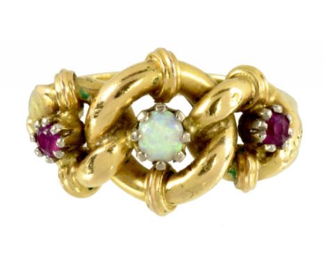 A RUBY AND OPAL THREE STONE RING  MARKED 18C, 4.4G, SIZE M ++In good second hand condition