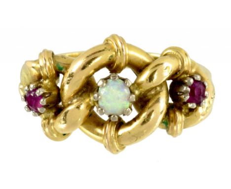 A RUBY AND OPAL THREE STONE RING  MARKED 18C, 4.4G, SIZE M ++In good second hand condition