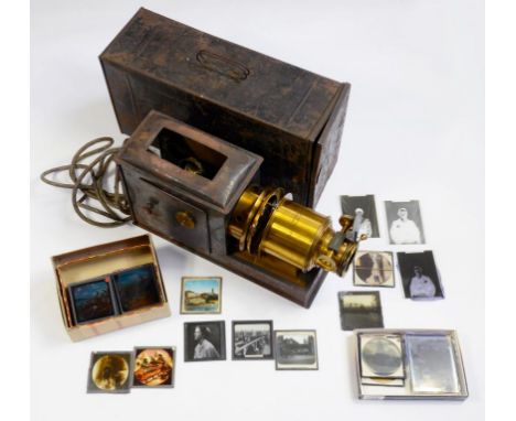 A LACQUERED BRASS AND FERROUS METAL MAGIC LANTERN, THE CONDENSER HOUSING STAMPED V PRAESTANTIA RILEY BROS LTD BRADFORD AND A 