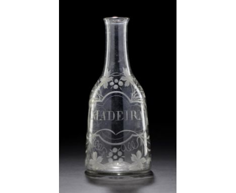 AN ENGLISH GLASS DECANTER, C1770 WHEEL ENGRAVED IN A CHAINED LABEL MADEIRA FRAMED BY VINES,  24.5CM H  ++In fine condition