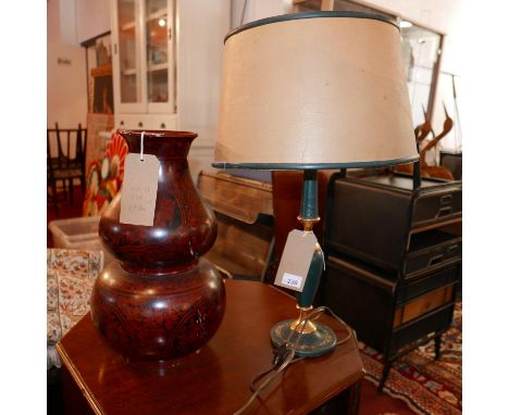 A 20th Century leather and brass table lamp with shade, together with an Oriental lacquered double gourd vase (2) 