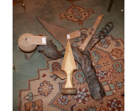 An oversized corkscrew with rustic branch handle, together with an acorn ashtray, vintage scythe and giltwood finial (4) 