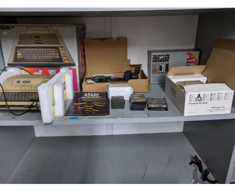 An Atari 400 computer with program recorder, cartridges and tapes and accessories, boxedLocation: G 