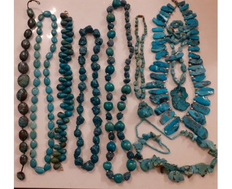 A quantity of 20th Century turquoise bead necklaces to include nugget style and rough-cut beads together with vintage turquoi