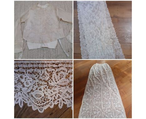 A quantity of lace to include 3metres of Honiton bobbin lace, an Edwardian cream lace wedding veil/shawl measuring 2.7m, an a