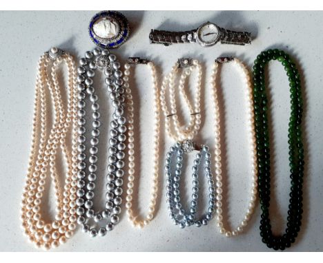 A quantity of good quality simulated pearl necklaces with silver clasps, a late 20th century jade bead necklace, a two string