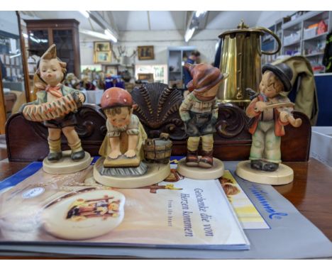 Eight Goebel figures to include: Photographer, Big clean, March winds, also a boy playing the violin and another playing the 