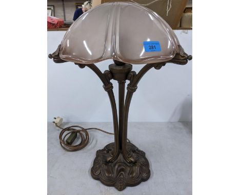 A reproduction metal Art Nouveau style table lamp with pink tinted frosted glass shade Location: 