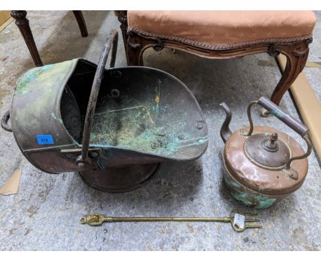 A helmet copper coal scuttle, a copper kettle, and a brass toasting fork Location: 