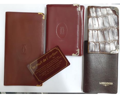 Must de Cartier - a vintage burgundy leather card wallet with certificate of authenticity and another with silver tone corner