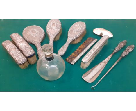 A silver 6 piece dressing table brush/mirror and comb set together with a silver collared glass scent bottle, a silver tone c