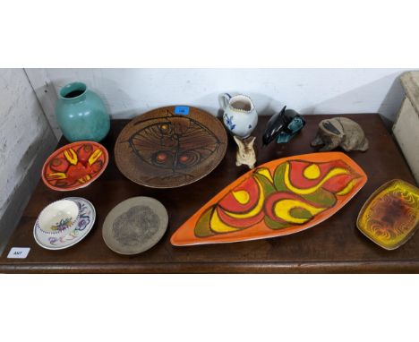 A collection of Poole pottery to include a Delphis spear dish, Aegean pottery, stoneware and pottery animal models, and other