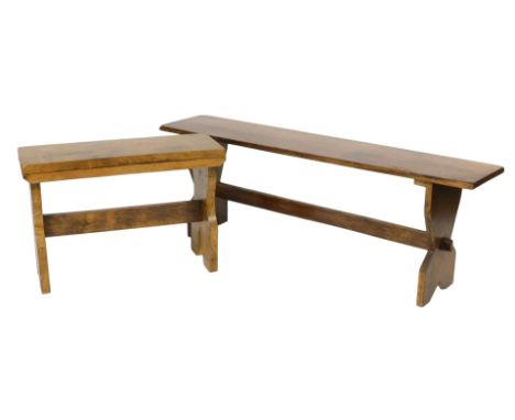 A 20thC oak trestle bench, 127cm wide, and a trestle stool, 67cm wide.  (2)