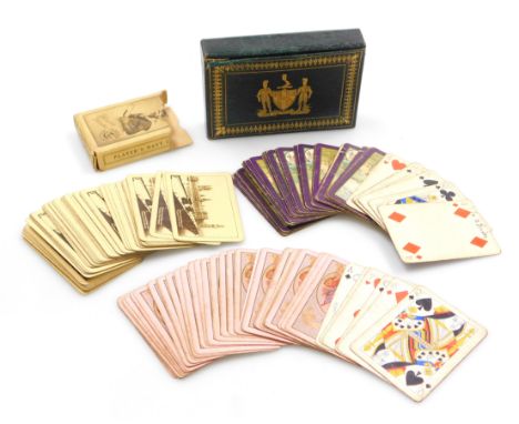Two packs of early 20thC Worshipful Company of Playing Cards playing cards, contained in a green morocco leather and gilt too