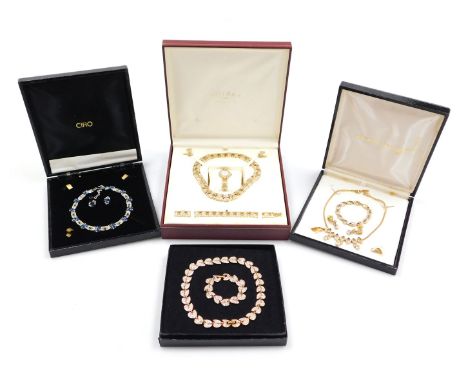 A Rotary parure of costume jewellery, gold plated and paste set, comprising a collar necklace, bracelet, pair of clip earring