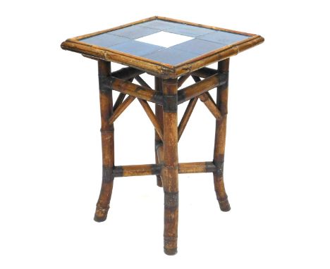 An early 20thC tile top bamboo occasional table, the square top inset with eight blue tiles around a single white tile, raise