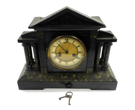 A late 19thC ebonised faux marble mantle clock, circular brass dial with chapter ring bearing Roman numerals, eight day movem