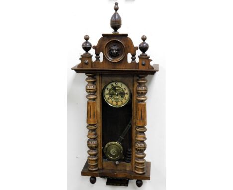 A late 19thC Vienna mahogany cased wall clock, circular brass dial embossed with flowers, chapter ring bearing Arabic numeral