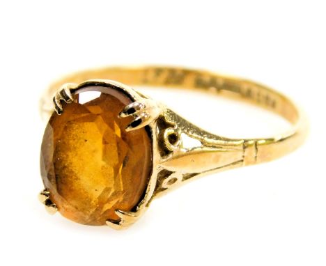 A 9ct gold ring set with a brilliant cut oval citrine, in a claw setting, 1.86g all in.