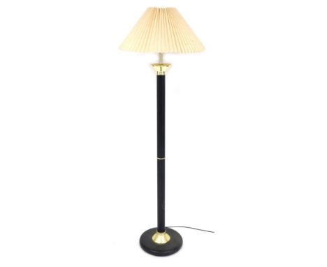 A black metal and brass capped standard lamp, with a frilled fabric shade, 149cm high.