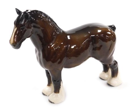 A Beswick brown glass model of a Shire horse, modelled standing, printed mark, 27.5cm high.