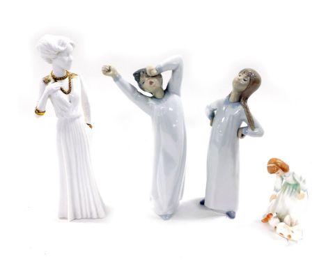 A Lladro porcelain figure of a boy in a night shirt, modelled yawning, another of a girl with her hands on her hips, Spode fi