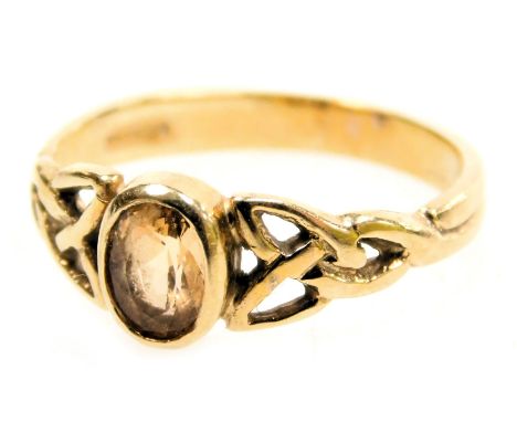 A Shipton &amp; Co 9ct gold Celtic design ring, set with an oval quartz, hallmarked, 2.60g all in.