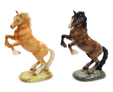 Two Beswick pottery figures of rearing horses, model number 1015, one Palomino, the other brown gloss, raised on naturalistic