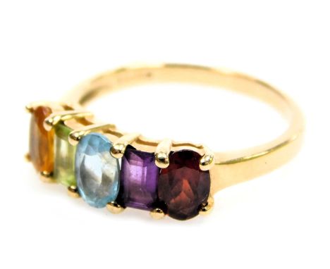 A 9ct gold and five stone rainbow ring, set with a garnet, amethyst, aquamarine, citrine and topaz, high claw set, size O, 2.