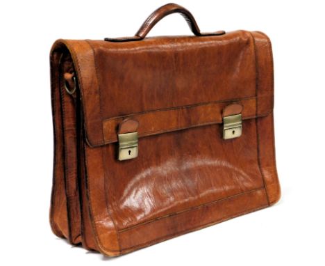 A tan leather briefcase, with leather shoulder strap, 44cm wide.