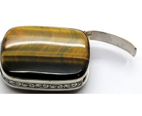 A vintage presumed silver vesta case set with two large Tigerseye panels, 4.5 x 3 cm, 34g. P&amp;P Group 1 (£14+VAT for the f