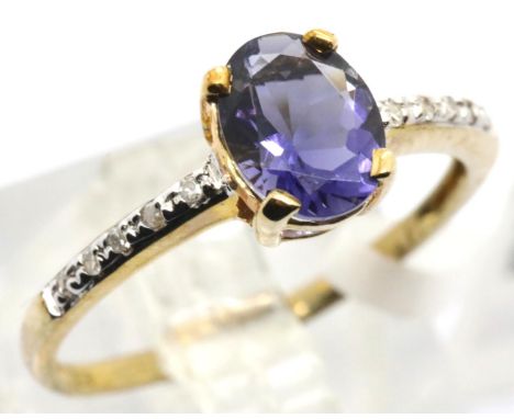 9ct gold tanzanite ring with diamond shoulders, size O, 1.7g. Condition report: Surface scratching to stone. Stamped 375 ring