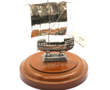 Sterling silver ship of Kyrenia, mounted on a turned plinth, H: 10 cm. P&amp;P Group 1 (£14+VAT for the first lot and £1+VAT 