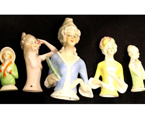 Five ceramic pin cushion dolls a nude example. P&amp;P Group 2 (£18+VAT for the first lot and £3+VAT for subsequent lots) 