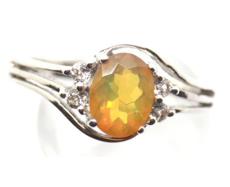 Sterling silver ring set with an Ethiopian opal and diamonds. Size S, 3.5g. P&amp;P Group 1 (£14+VAT for the first lot and £1