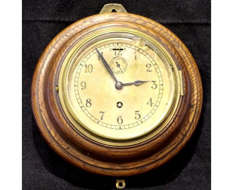 Oak cased brass faced wall clock, not working at lotting, overall D: 27 cm. P&amp;P Group 3 (£25+VAT for the first lot and £5