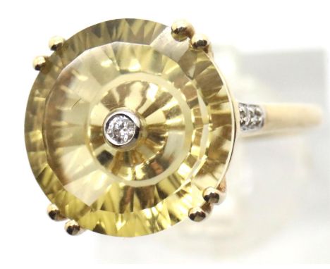 9ct yellow gold ring with a small diamond set in a large citrine? Size N, 3.2g. Condition report: Shank stamped 417 TGGC 23/3