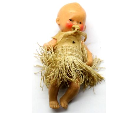 Antique German ceramic baby figurine with original clothing. P&amp;P Group 1 (£14+VAT for the first lot and £1+VAT for subseq