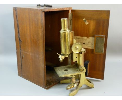 AN ALL BRASS SWIFT & BECK MICROSCOPE  with no supplementary lenses in a mahogany case