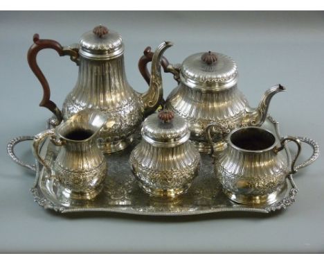 A FIVE PIECE ELECTROPLATED TEA & COFFEE SERVICE, each circular based piece having a band of scrolls and flowers with reeded d