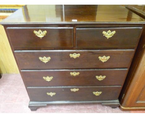 AN EARLY 19th CENTURY MAHOGANY CHEST of three long and two short drawers with brass lockplates and matching drop handles, on 
