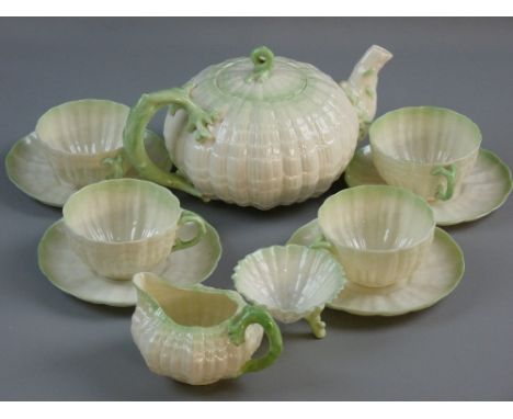 AN ELEVEN PIECE BELLEEK 'TRIDANCA' TEA SERVICE, second period black backstamp on white porcelain with green highlighting and 