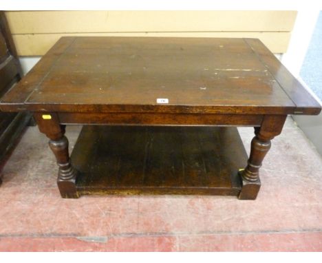 AN OBLONG OAK OCCASIONAL TABLE having turned supports and a low base shelf, possibly the top of a piece of furniture, 90 cms 