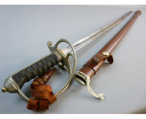 A GRVI ROYAL ARTILLERY OFFICER'S SWORD with scabbard, 86 cms etched steel blade marked 'Made in England' with basket hilt and