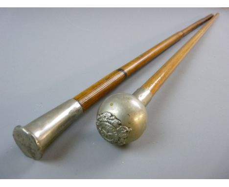TWO REGIMENTAL SWAGGER STICKS, bamboo with white metal top having a dragon emblem and the letters 'R W F' and a natural wood 